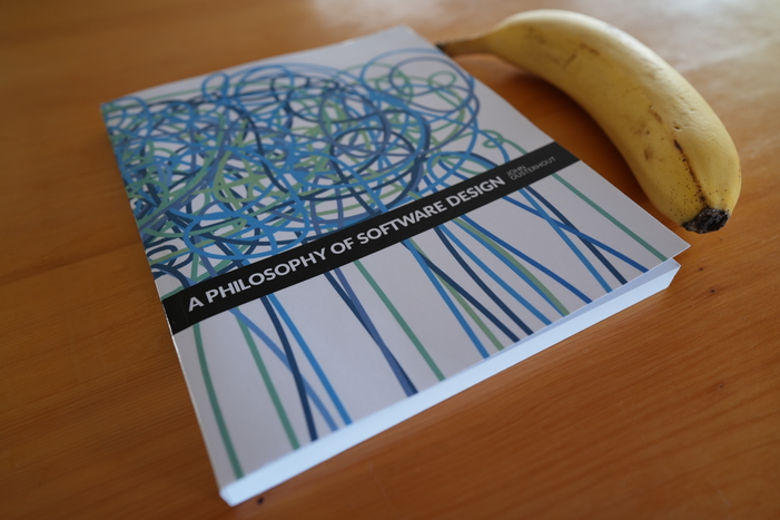 A photograph of the book A Philosophy of Software Design with a banana for scale